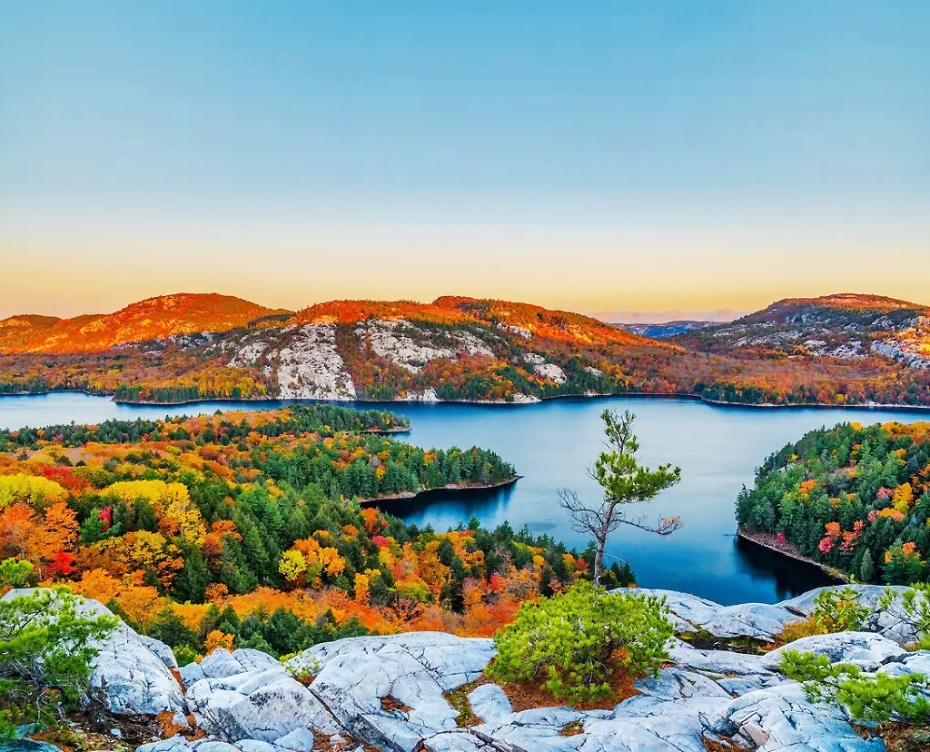 Northern Ontario lake and autumn forest viewed from rocky high ground